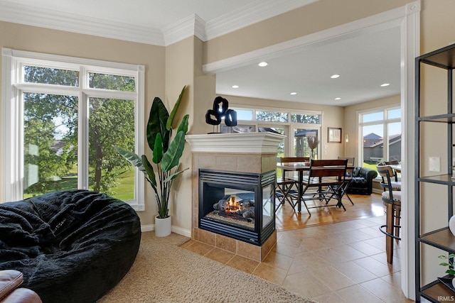 1669 E Brookside Trl, Columbia City, IN 46725 - living room featuring a tile fireplace, recessed lighting, crown molding, and tile patterned floors