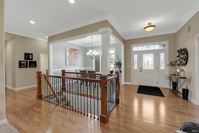 1669 E Brookside Trl, Columbia City, IN 46725 - entryway with light wood-style floors, a chandelier, ornamental molding, and recessed lighting