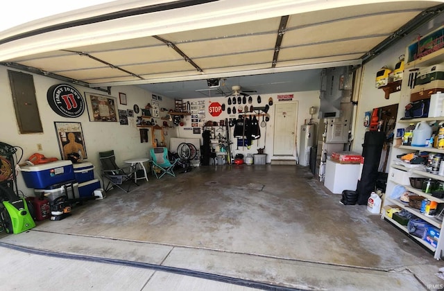 6970 S Maple St, Marion, IN 46953 - garage featuring electric panel, a garage door opener, and water heater