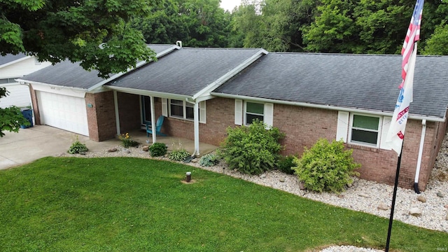 6970 S Maple St, Marion, IN 46953 - ranch-style house with brick siding, roof with shingles, a front yard, and an attached garage