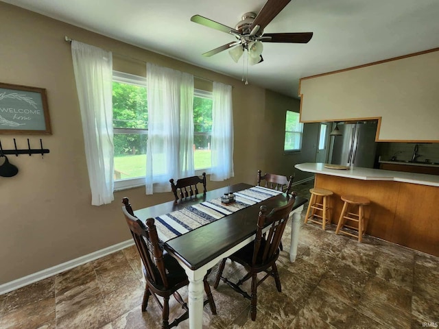 6970 S Maple St, Marion, IN 46953 - dining room featuring stone finish flooring and a ceiling fan