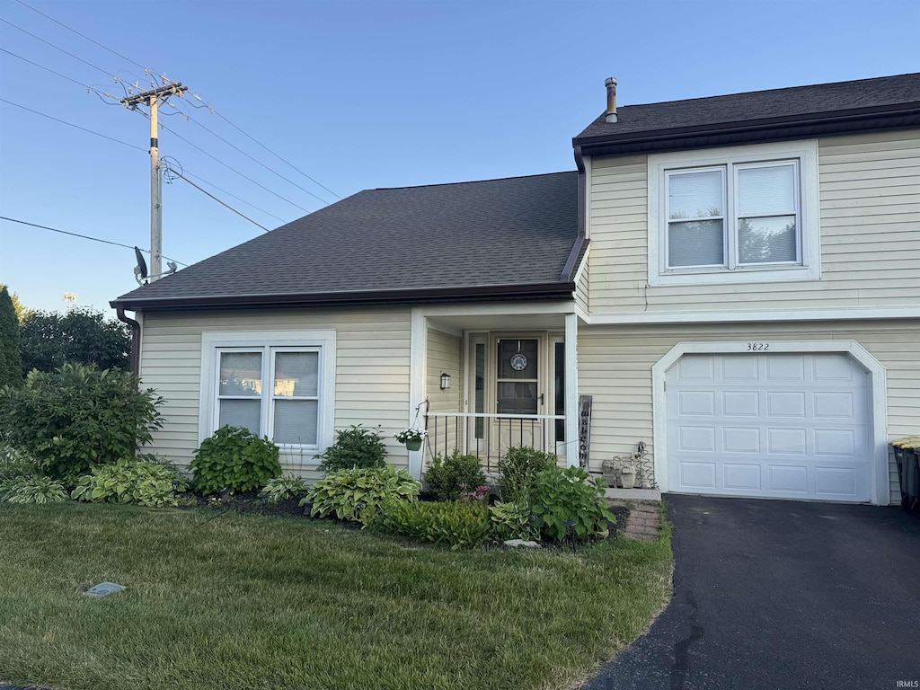 3822 Yardley Ct, Fort Wayne, IN 46815 - view of front of property featuring a front lawn, a shingled roof, an attached garage, and driveway