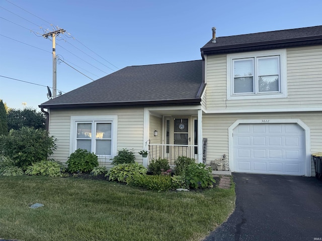3822 Yardley Ct, Fort Wayne, IN 46815 - view of front of property featuring a front lawn, a shingled roof, an attached garage, and driveway