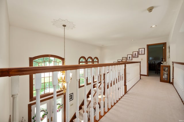 1726 Tall Oaks Dr, Kokomo, IN 46901 - hallway with a chandelier, an upstairs landing, carpet flooring, and recessed lighting