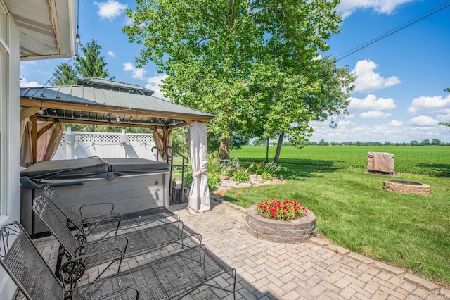 1726 Tall Oaks Dr, Kokomo, IN 46901 - view of patio featuring a hot tub, a gazebo, and a rural view