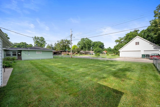 501 S Tara Ln, Muncie, IN 47304 - fenced backyard featuring a detached garage