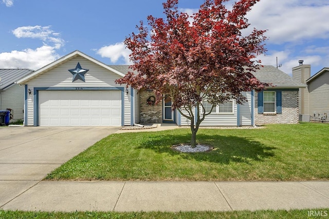 2308 E Southway Blvd, Kokomo, IN 46902 - obstructed view of property featuring an attached garage, driveway, and a front lawn