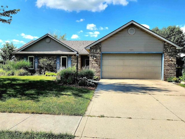 9421 Mill Ridge Run, Fort Wayne, IN 46835 - single story home featuring brick siding, a garage, concrete driveway, and a front yard