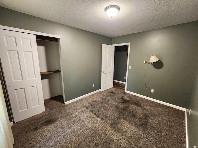 9421 Mill Ridge Run, Fort Wayne, IN 46835 - unfurnished bedroom featuring carpet flooring, a textured ceiling, and a closet