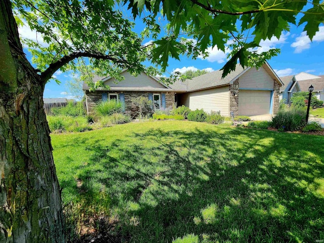 9421 Mill Ridge Run, Fort Wayne, IN 46835 - ranch-style house featuring an attached garage, a front lawn, and stone siding