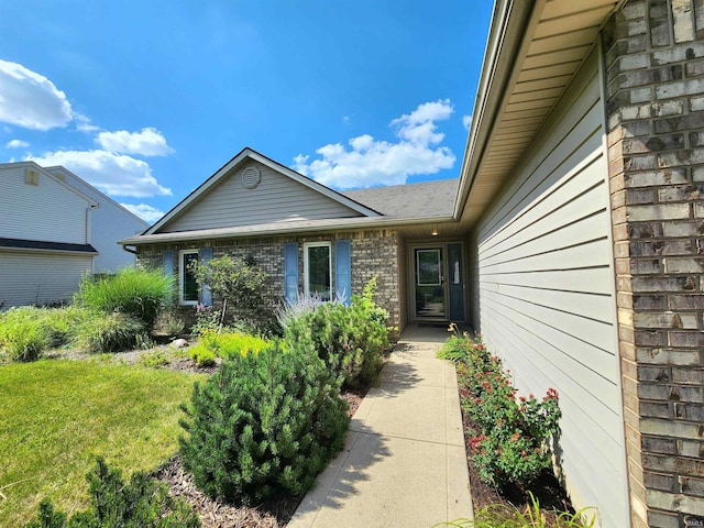 9421 Mill Ridge Run, Fort Wayne, IN 46835 - property entrance featuring brick siding and a yard