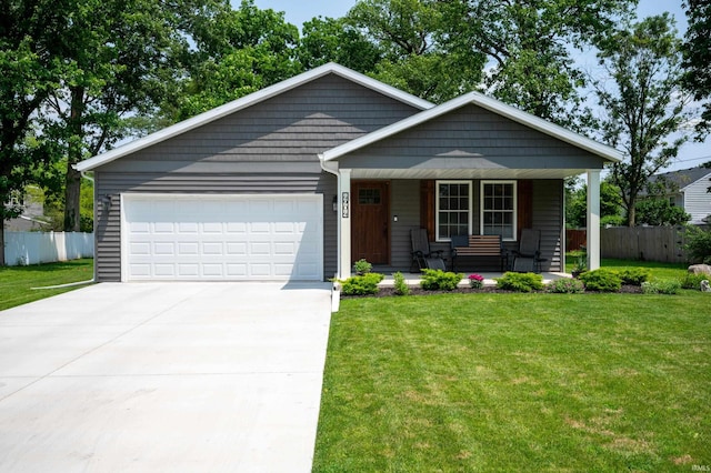 4904 N Hamilton Ln, Muncie, IN 47304 - view of front of property with a porch, a garage, and concrete driveway
