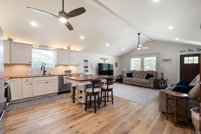 4904 N Hamilton Ln, Muncie, IN 47304 - kitchen with a ceiling fan, stainless steel dishwasher, wood counters, open floor plan, and light wood finished floors