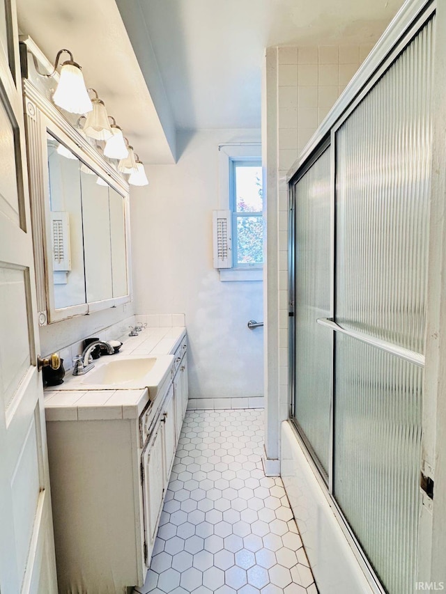 1028 N Wabash Ave, Marion, IN 46952 - bathroom with double vanity and bath / shower combo with glass door