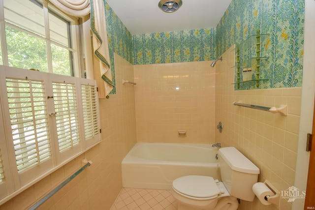 3400 W University Ave, Muncie, IN 47304 - bathroom with tile walls, tile patterned flooring, and shower / bathtub combination