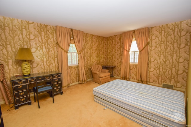 3400 W University Ave, Muncie, IN 47304 - bedroom featuring wallpapered walls, multiple windows, and carpet flooring