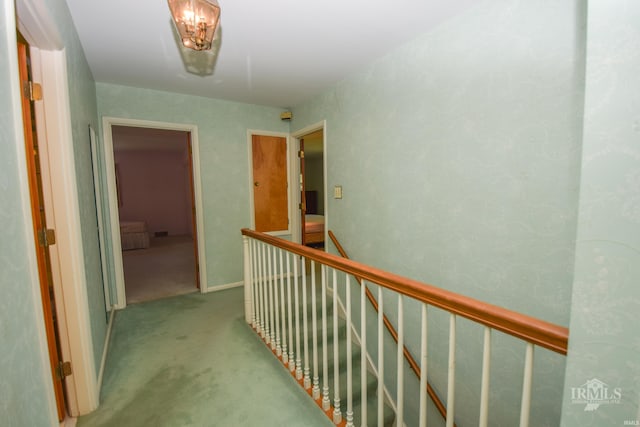 3400 W University Ave, Muncie, IN 47304 - hallway featuring an upstairs landing and carpet