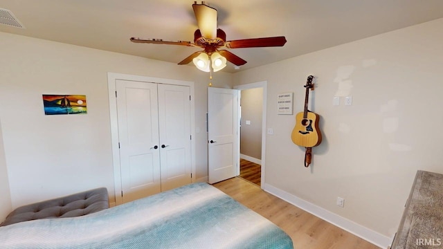 4229 New Birch Dr, Jasper, IN 47546 - bedroom featuring light wood-style flooring, a closet, and a ceiling fan