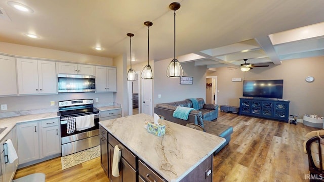4229 New Birch Dr, Jasper, IN 47546 - kitchen featuring stainless steel appliances, open floor plan, coffered ceiling, ceiling fan, and a center island