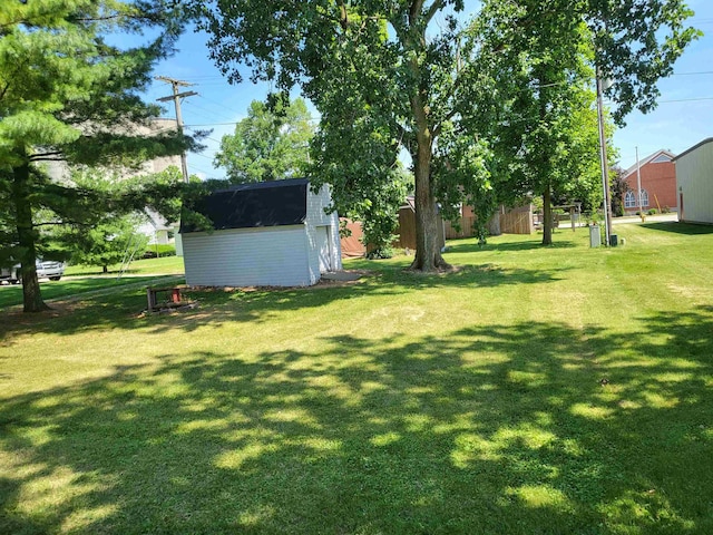 202 Webster St, Monroeville, IN 46773 - view of grassy yard featuring a storage unit