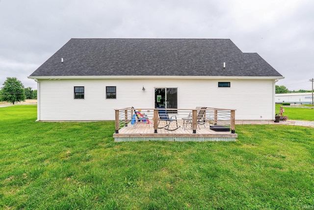 4555 E State Road 66, Cannelton, IN 47520 - rear view of house featuring a deck, a yard, and a shingled roof