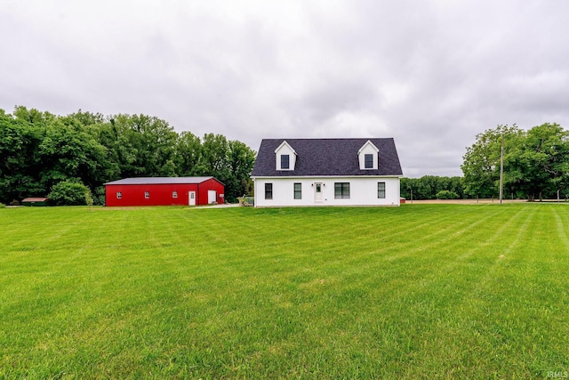 4555 E State Road 66, Cannelton, IN 47520 - back of house featuring a lawn, an outbuilding, an outdoor structure, and a detached garage