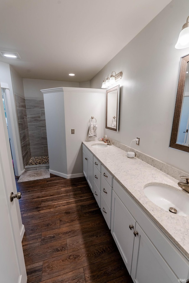 4555 E State Road 66, Cannelton, IN 47520 - full bathroom featuring double vanity, a walk in shower, wood finished floors, and recessed lighting