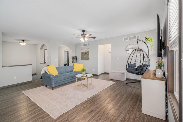 2010 Newbury Cir, Goshen, IN 46526 - living room with arched walkways, dark wood-type flooring, and ceiling fan