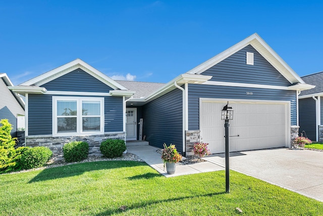 2010 Newbury Cir, Goshen, IN 46526 - single story home with stone siding, a garage, a front yard, and concrete driveway