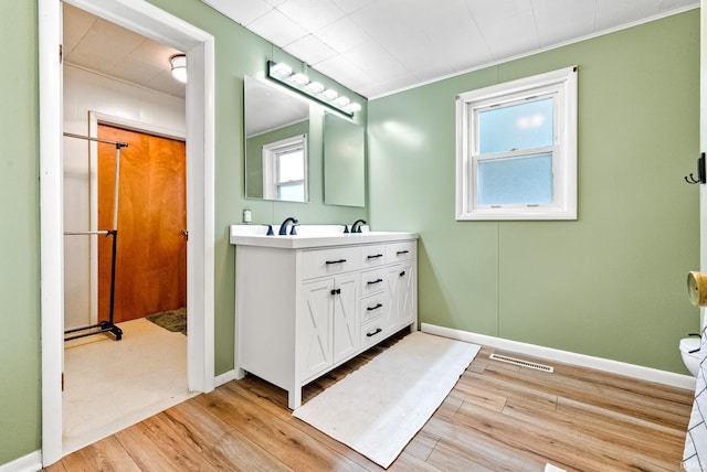110 N Maple St, South Whitley, IN 46787 - full bathroom with wood finished floors and double vanity