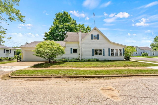 110 N Maple St, South Whitley, IN 46787 - traditional-style house featuring driveway, a garage, and a front lawn
