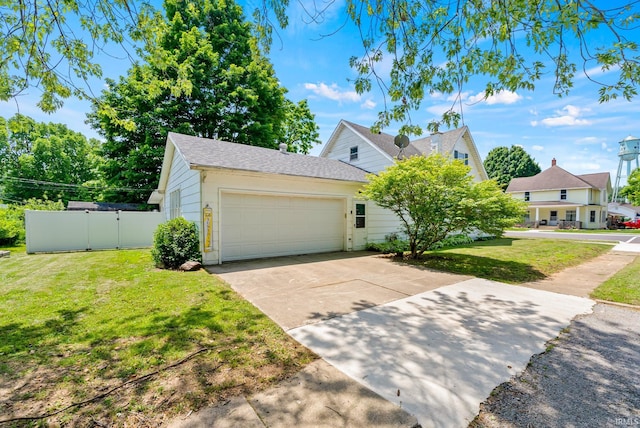 110 N Maple St, South Whitley, IN 46787 - view of front of house with an attached garage, driveway, and a shingled roof