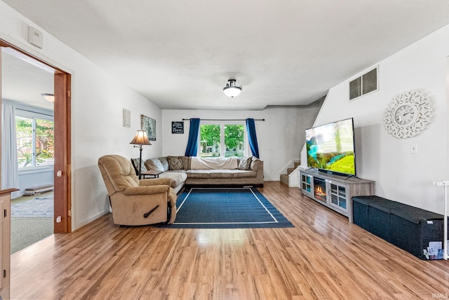 110 N Maple St, South Whitley, IN 46787 - living room featuring light wood-style flooring and baseboards