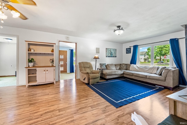 110 N Maple St, South Whitley, IN 46787 - living room with light wood-style floors and a ceiling fan