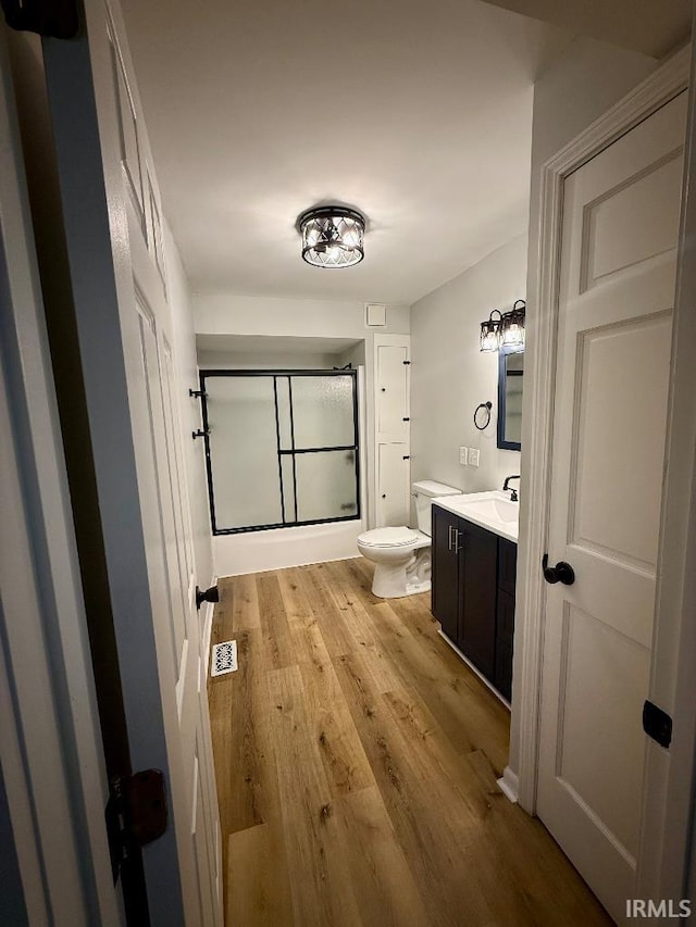 1228 N Main St, Kewanna, IN 46939 - full bath with vanity, a shower, and wood finished floors