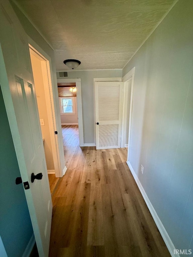 1228 N Main St, Kewanna, IN 46939 - corridor featuring baseboards and wood finished floors
