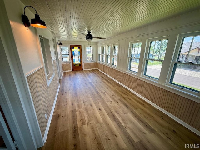 1228 N Main St, Kewanna, IN 46939 - unfurnished sunroom featuring wood finished floors, healthy amount of natural light, and wooden ceiling