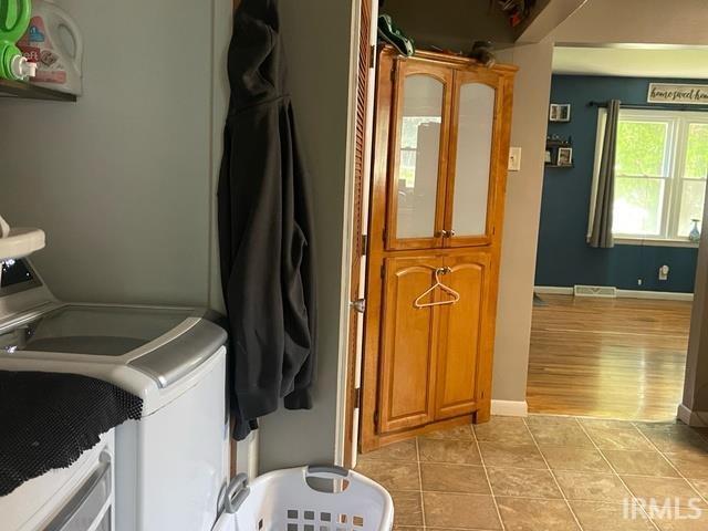 928 E Sherman St, Mount Vernon, IN 47620 - laundry area with light tile patterned flooring and independent washer and dryer