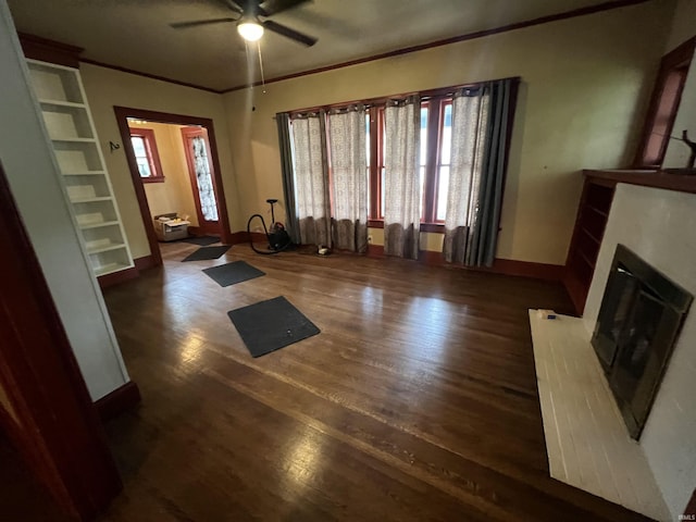 912 Broadway St, Vincennes, IN 47591 - unfurnished living room with a ceiling fan, wood finished floors, crown molding, and a glass covered fireplace