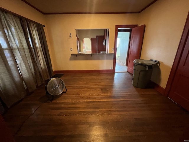 912 Broadway St, Vincennes, IN 47591 - empty room featuring crown molding and dark wood-style flooring