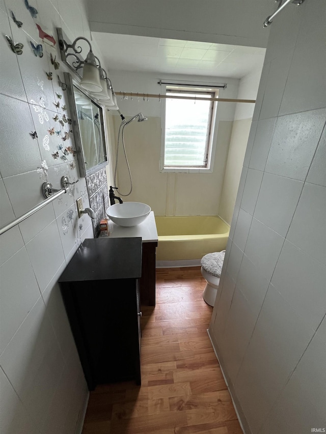 912 Broadway St, Vincennes, IN 47591 - full bath with tub / shower combination, wood finished floors, and vanity