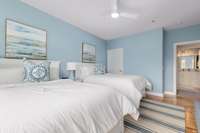 1219 Napoleon St Unit 217, South Bend, IN 46617 - bedroom featuring wood finished floors, ceiling fan, and ensuite bathroom