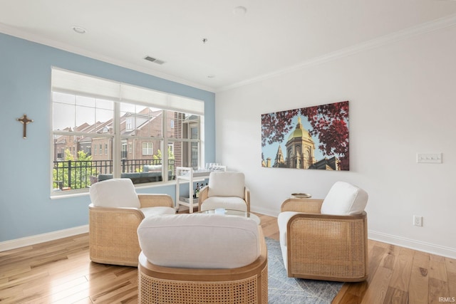 1219 Napoleon St Unit 217, South Bend, IN 46617 - sitting room featuring wood finished floors and crown molding