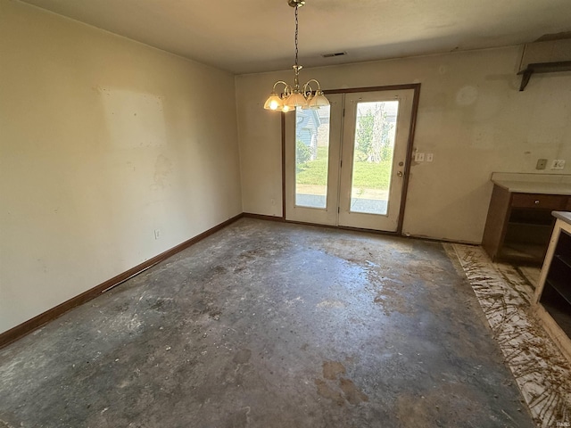 4520 Obing Strasse, Jasper, IN 47546 - unfurnished dining area featuring a chandelier and concrete floors