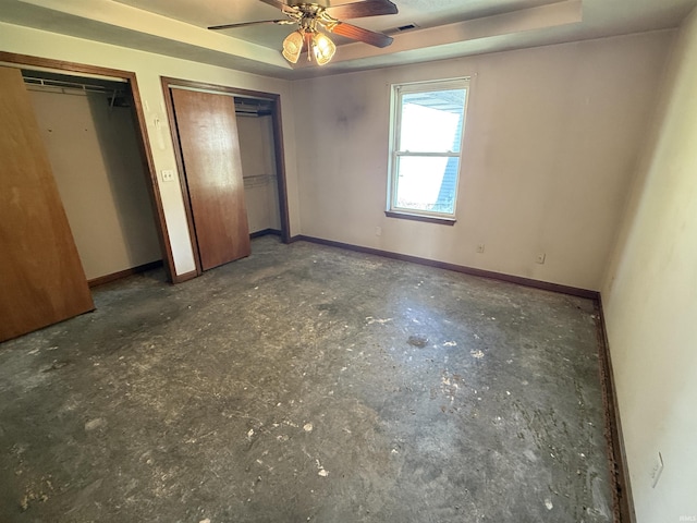 4520 Obing Strasse, Jasper, IN 47546 - unfurnished bedroom featuring two closets and a tray ceiling
