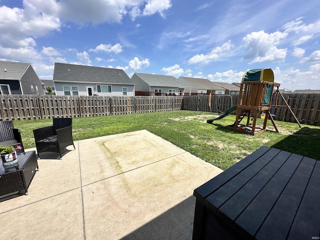 4805 Langhorn Trl, Lafayette, IN 47909 - fenced backyard featuring a patio area, a residential view, and a playground