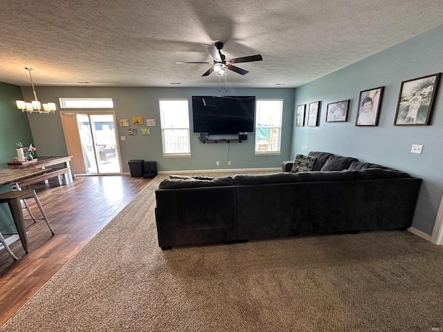 4805 Langhorn Trl, Lafayette, IN 47909 - living area featuring ceiling fan, wood finished floors, a textured ceiling, and a chandelier