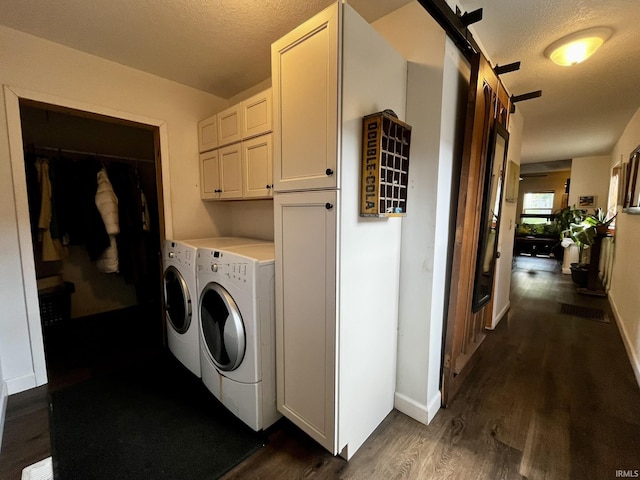 1326 W Main St, Fort Wayne, IN 46808 - washroom featuring independent washer and dryer, dark wood-style floors, cabinet space, a textured ceiling, and a barn door