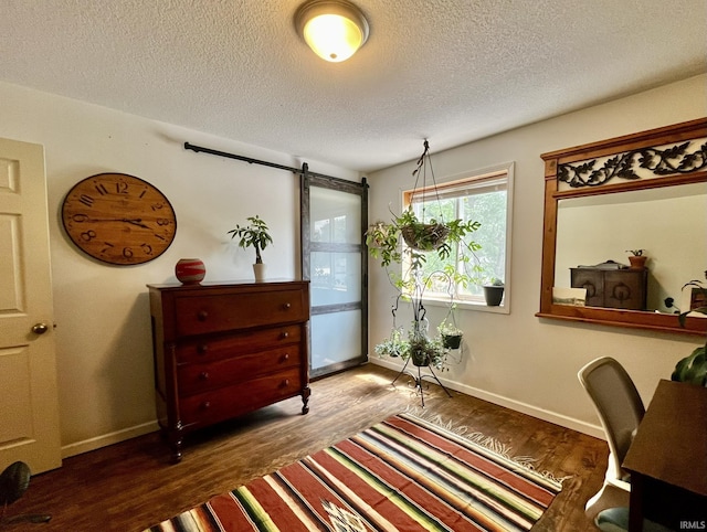 1326 W Main St, Fort Wayne, IN 46808 - office area featuring wood finished floors, a textured ceiling, and a barn door