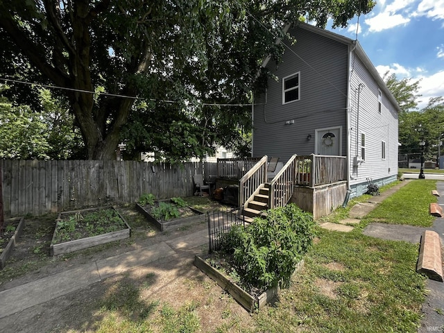 1326 W Main St, Fort Wayne, IN 46808 - rear view of house featuring a garden and a deck